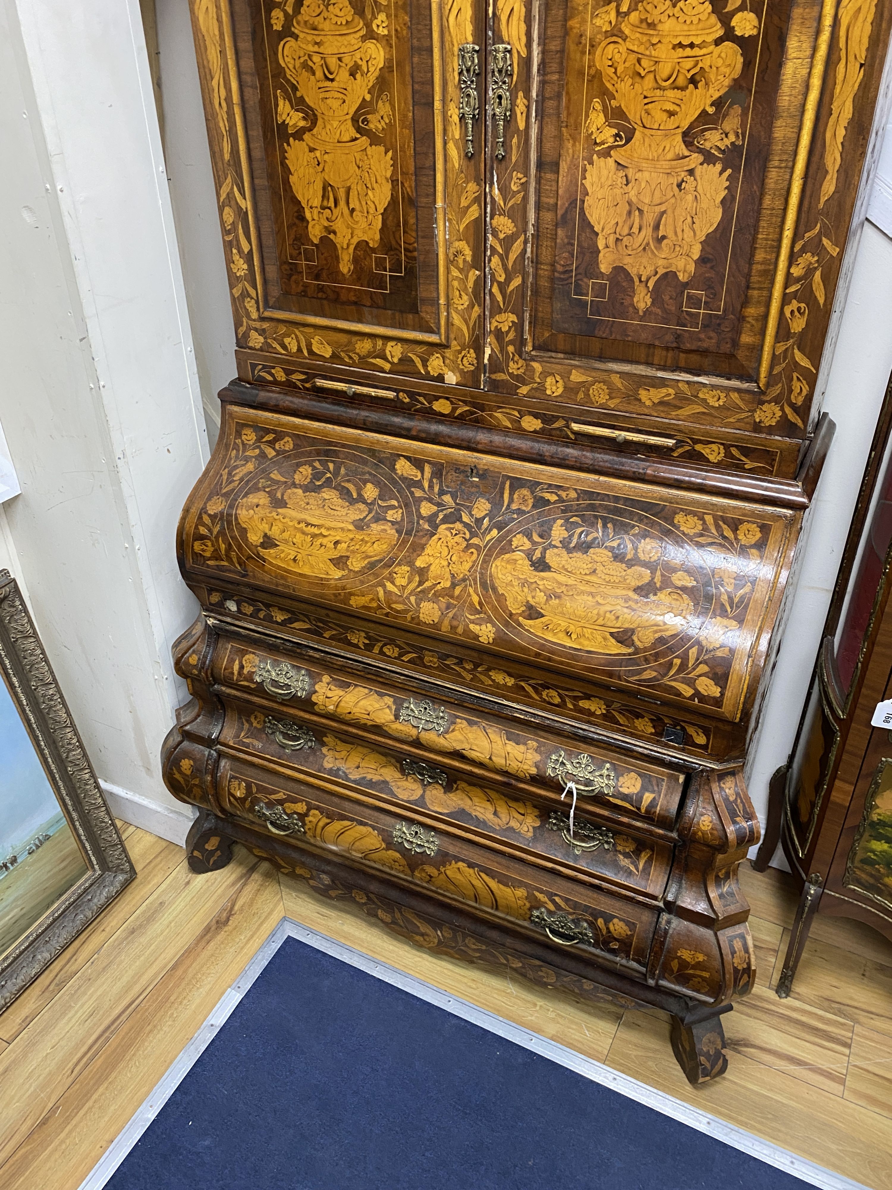 A Dutch floral marquetry walnut bombe bureau cabinet, width 120cm, depth 60cm, height 210cm